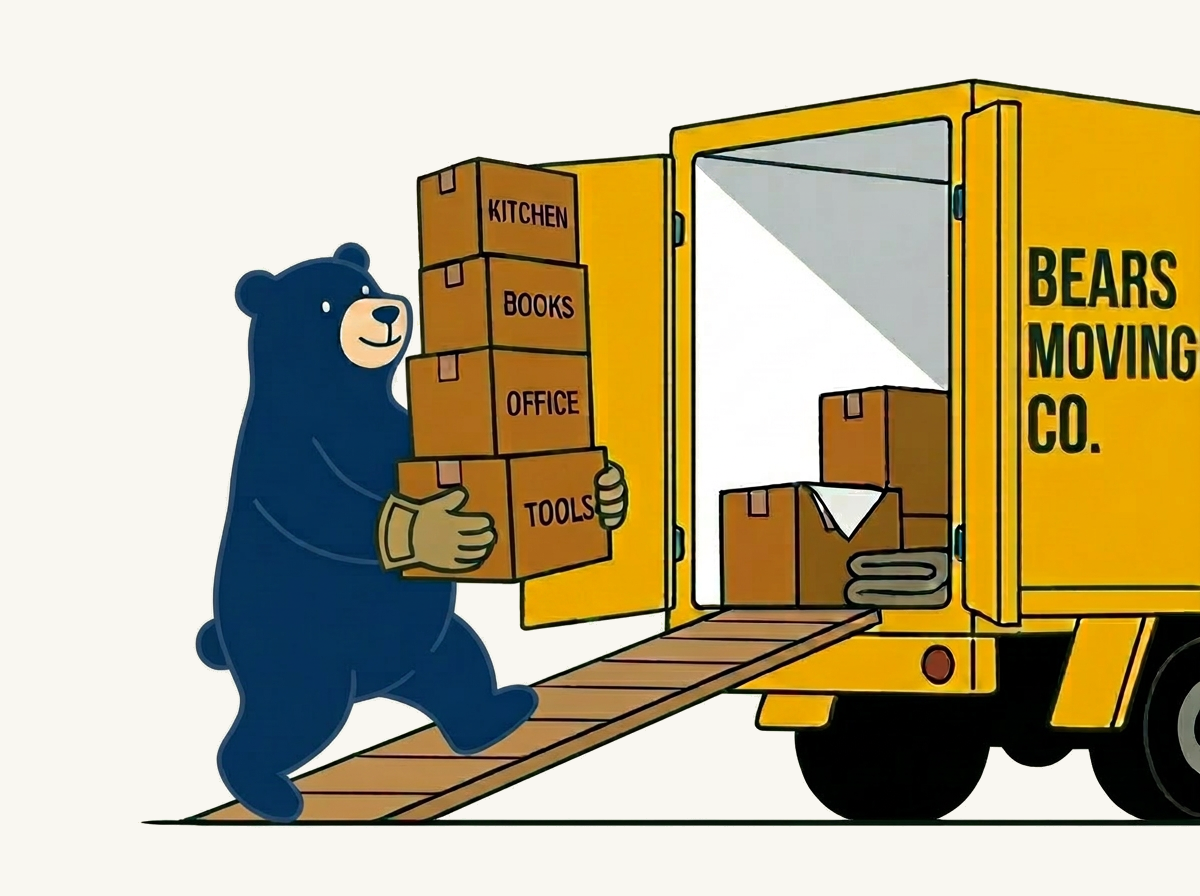 Bear loading moving boxes into a box truck